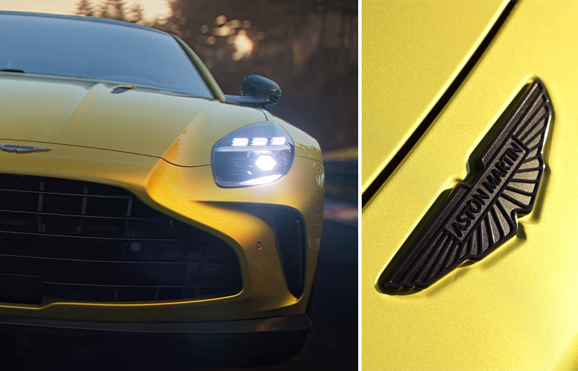 Front fiew of yellow Aston Martin Vantage on the left and Aston Martin logo on the right